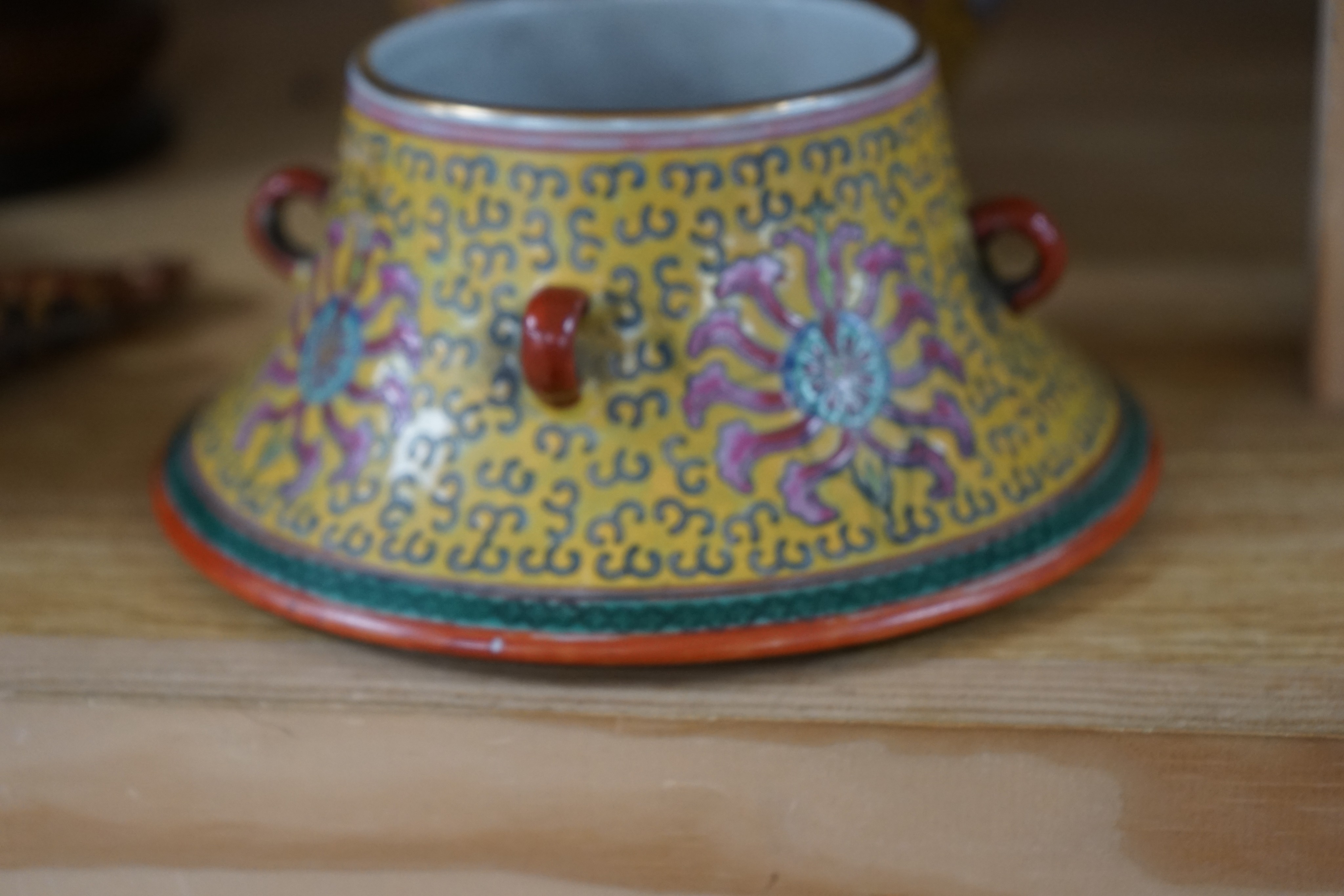 A Japanese porcelain cylindrical vase and a Chinese yellow ground two-section vessel and cover, 29cm